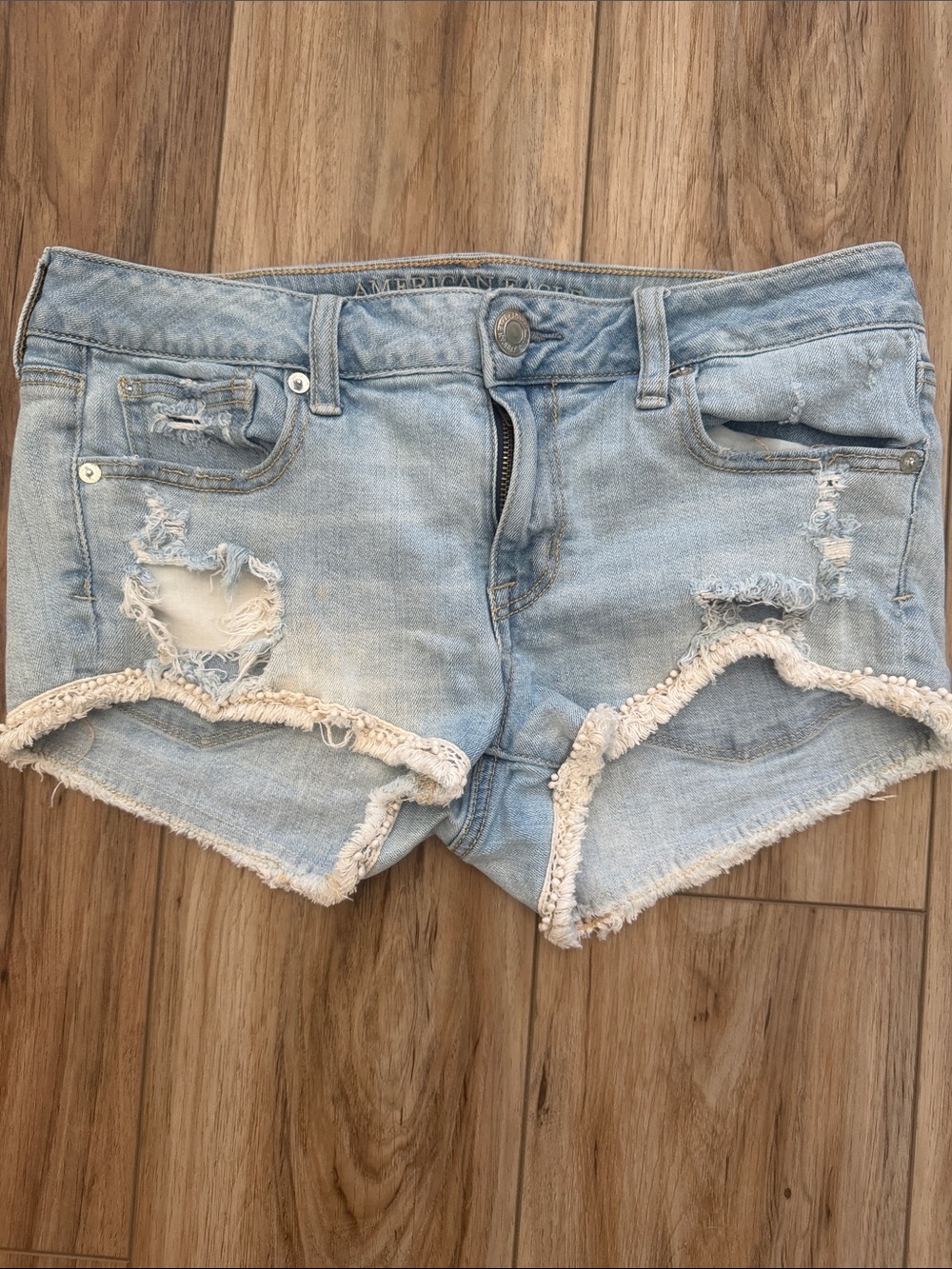 American Eagle Shortie Distressed Denim Shorts Pom Pom Fringe Cutoff Y2K 10